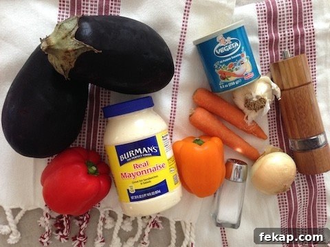 Ingredients for eggplant rollups: eggplants, onion, carrots, bell peppers, garlic, mayonnaise and seasonings