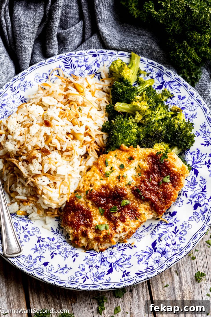This quick and easy melt in your mouth chicken is so flavorful, creamy, and tender. Toss a salad and serve over rice or noodles. Dinner in 30 minutes! #meltinyourmouthchicken #30minutemeals a piece of melt in your mouth chicken breast with broccoli and rice on a plate