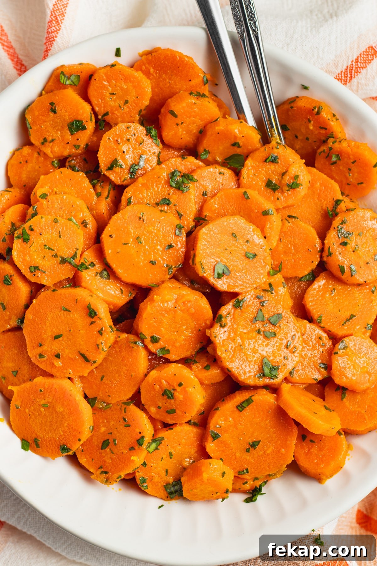 Butter-Glazed French Vichy Carrots Recipe 11 This is a picture of a bowl filled with Vichy carrots.