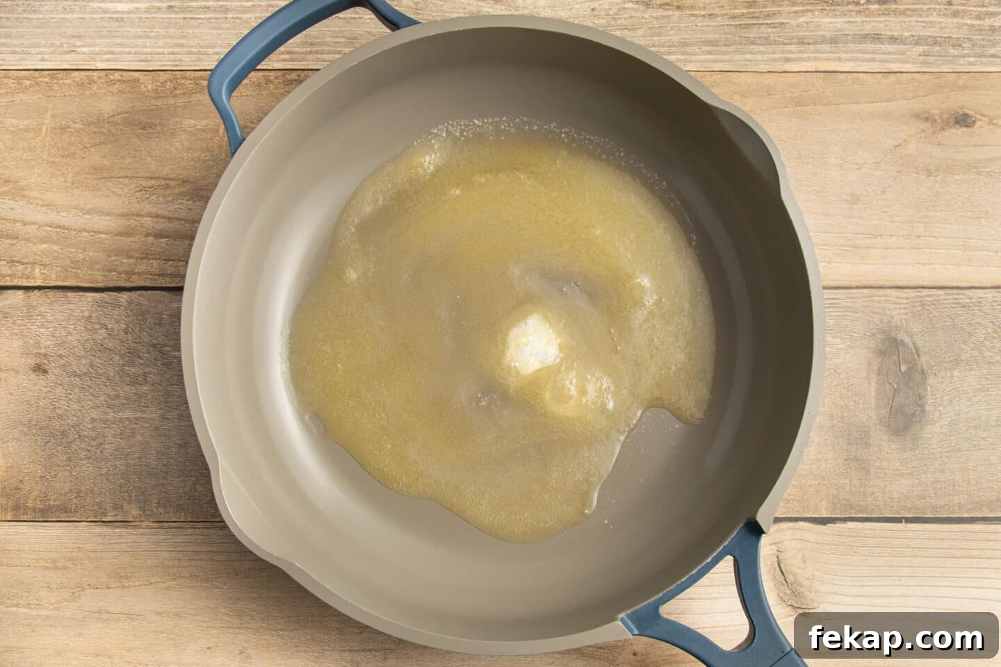 Butter-Glazed French Vichy Carrots Recipe 4 This is a picture of butter and sugar melting in a skillet.