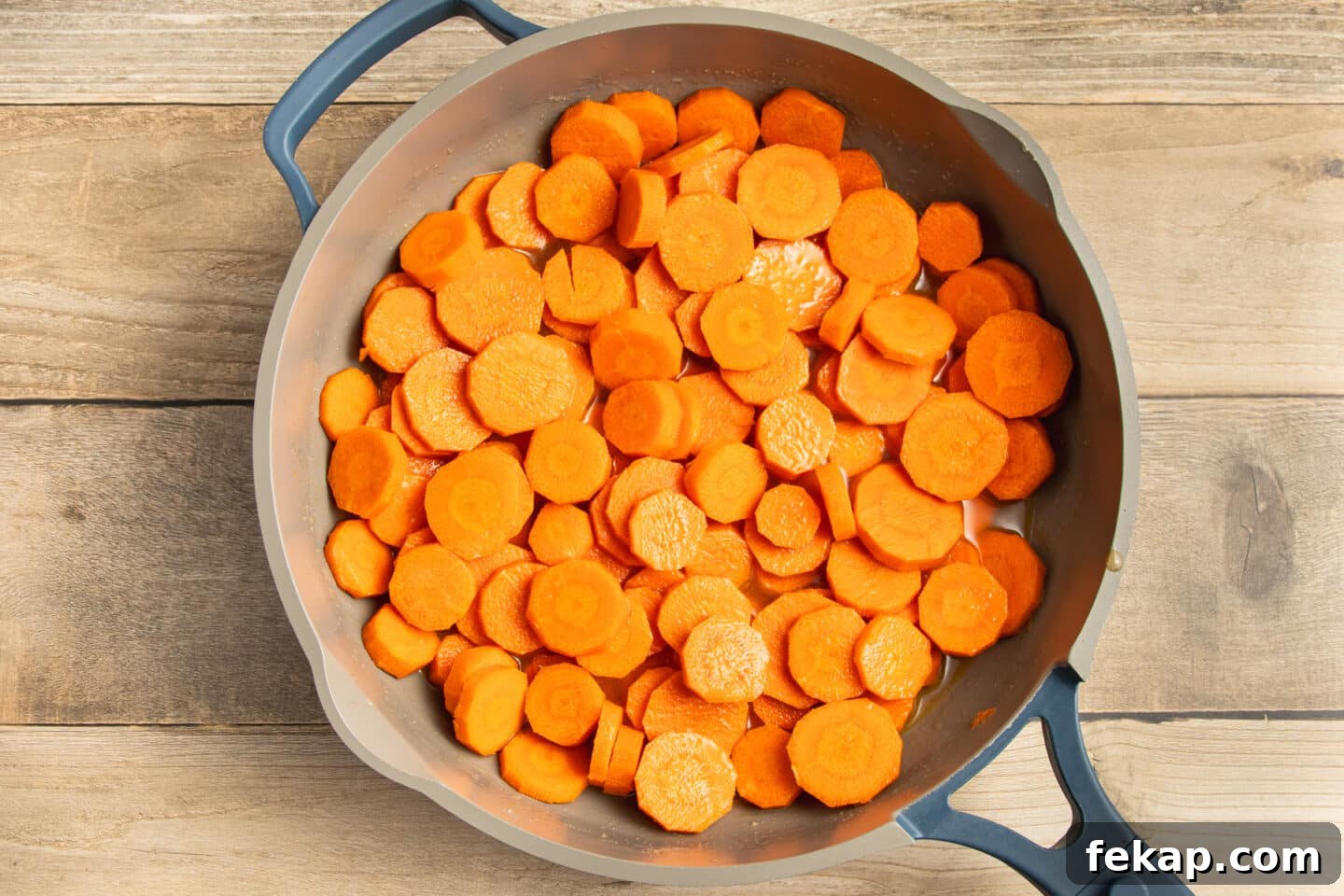 Butter-Glazed French Vichy Carrots Recipe 5 This is a picture of a skillet with the vichy carrots cooking.