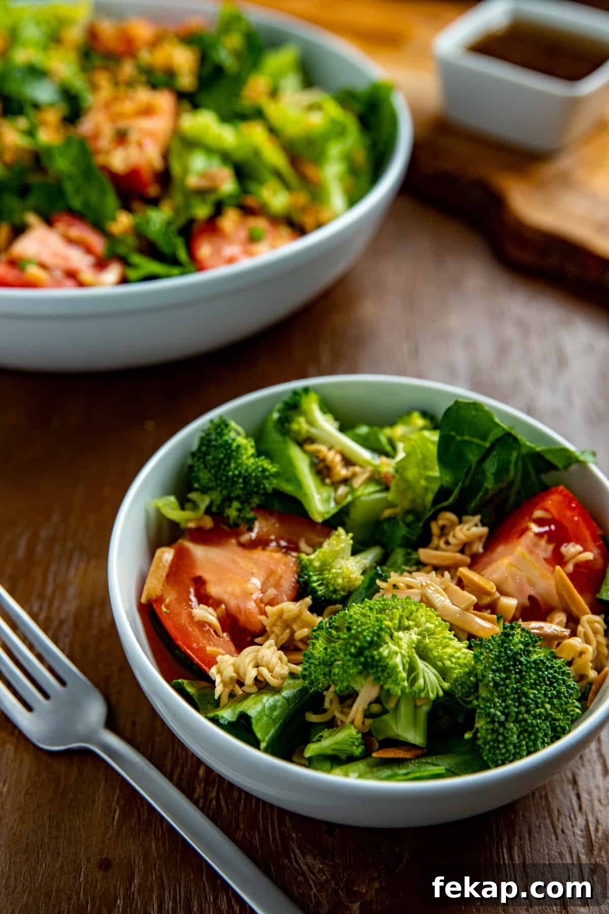 Crunchy Asian Ramen Noodle Salad with Sesame Ginger Dressing 5 finished salad in two white salad bowl