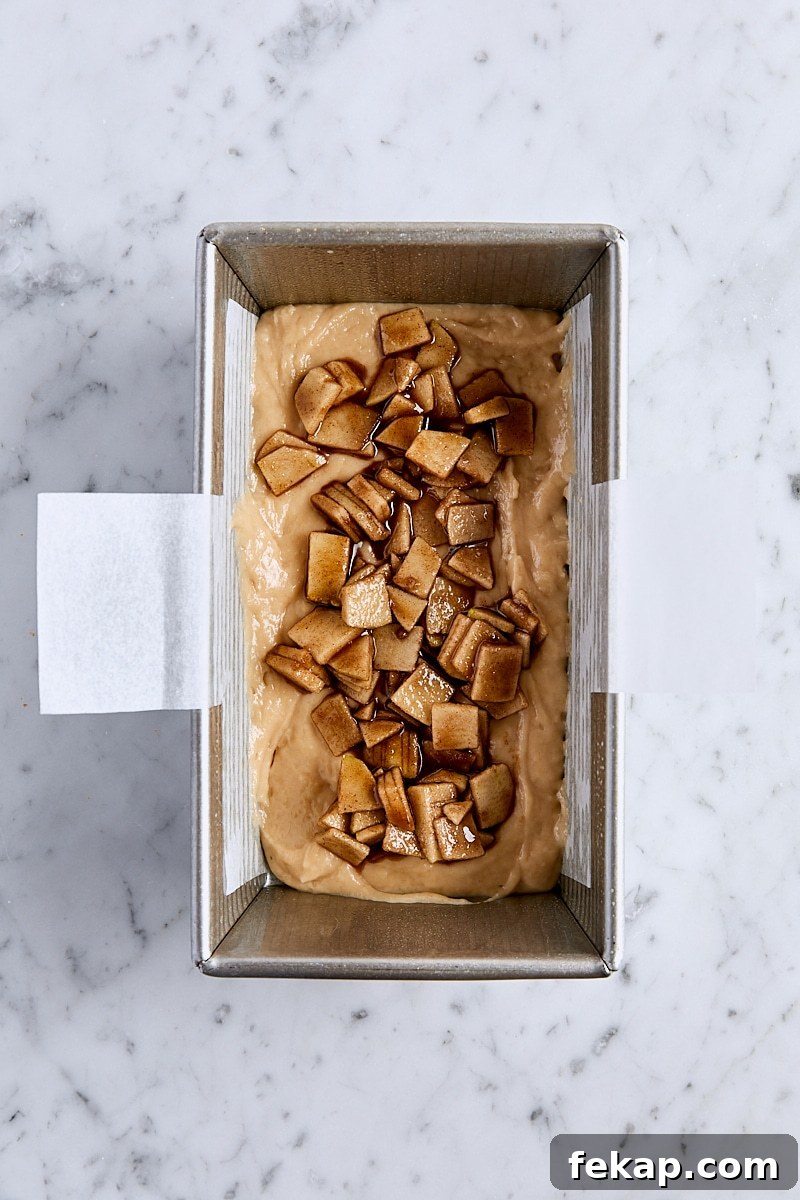 Apple fritter batter topped with brown sugar-apples