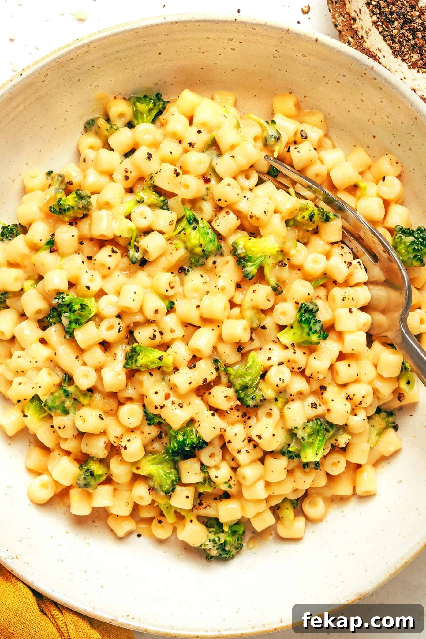 Bowl of creamy broccoli pasta with cheese
