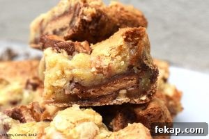 Peanut Butter Cup Blondies Recipe 4 White chocolate peanut butter blondies sliced into thick dessert bars