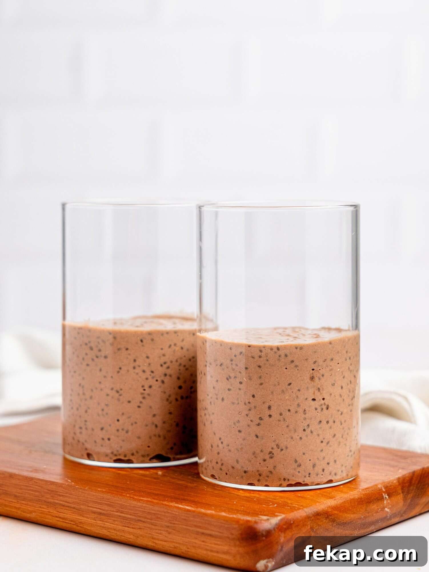 4-Ingredient High-Protein Chia Pudding 7 Protein chia pudding in glass jars.