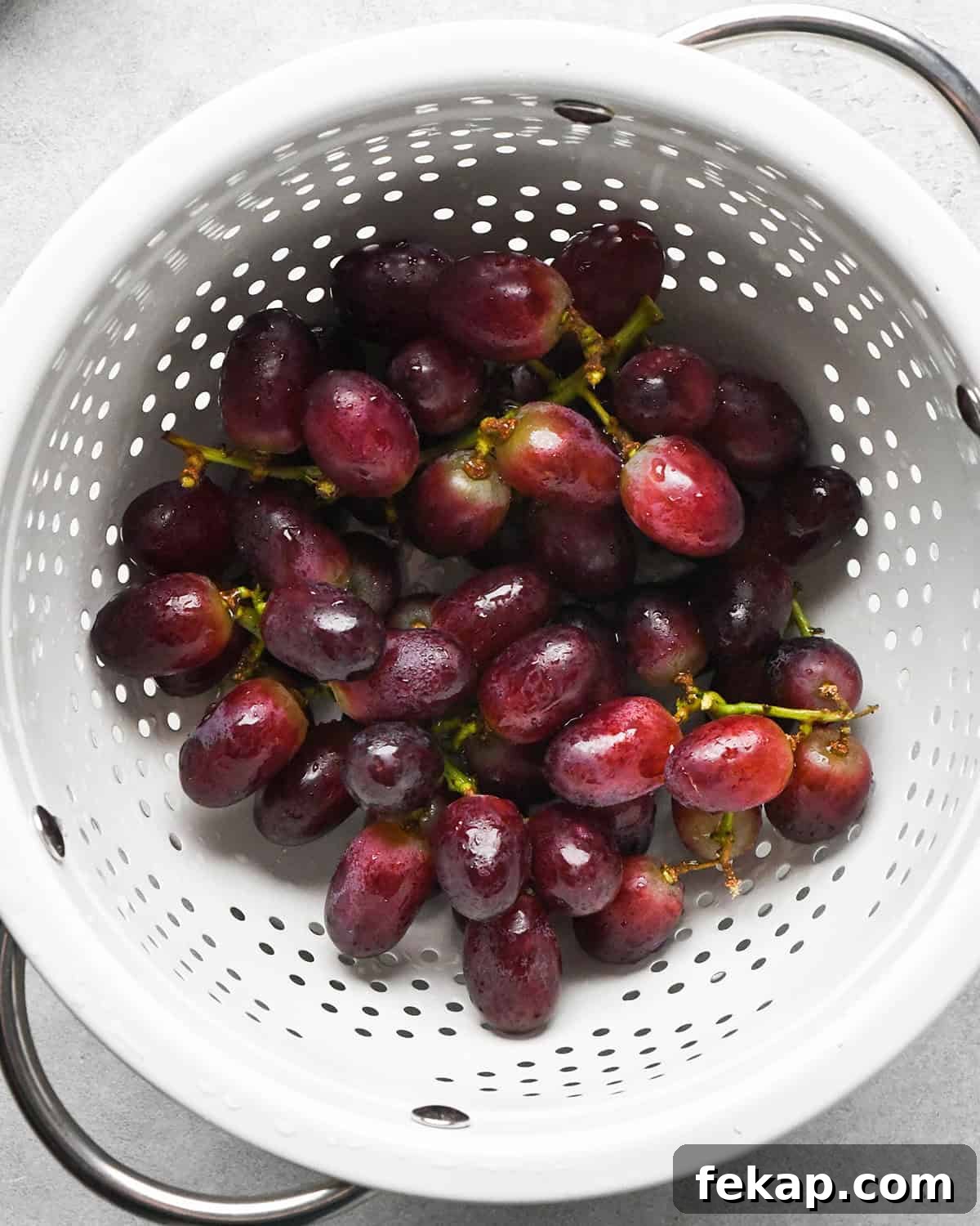 How to Make a Charcuterie Board - red grapes in a colander