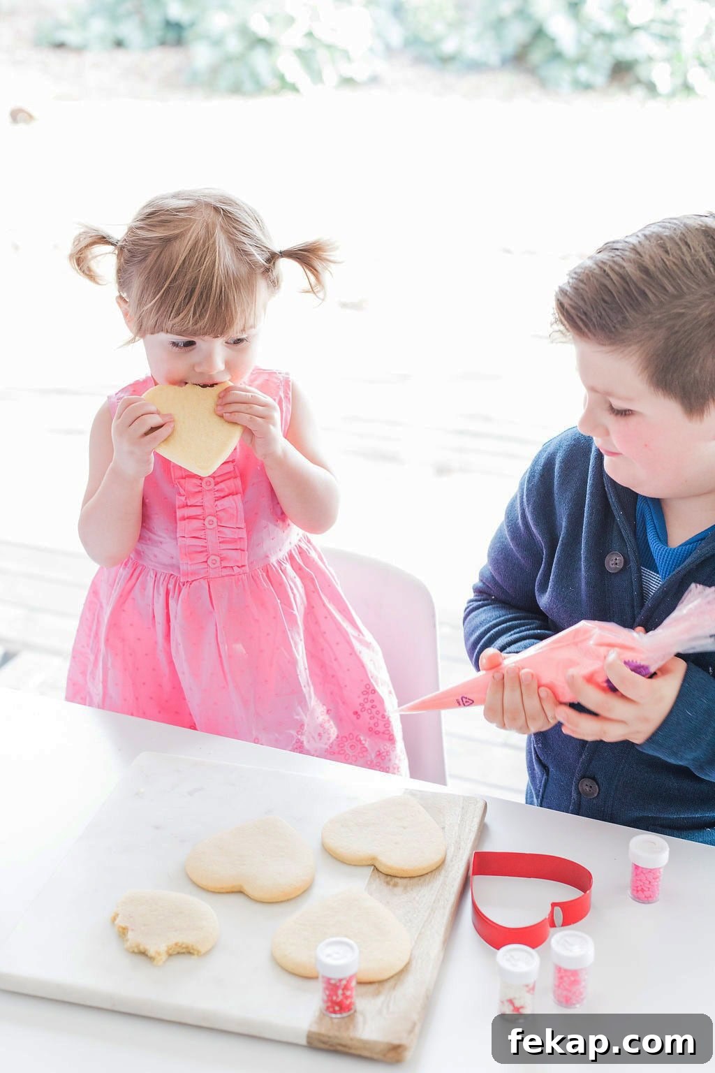 Cut Out Sugar Cookie Recipe for Perfect Shapes 4 Two small children decorating cookies.