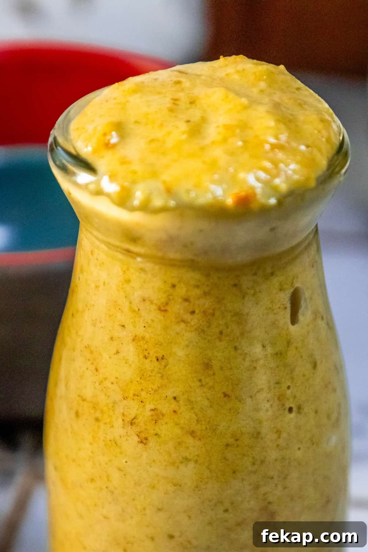 Homemade Habanero Hot Sauce Recipe: Fiery Flavor 4 A jar of habanero hot sauce sitting on a table.